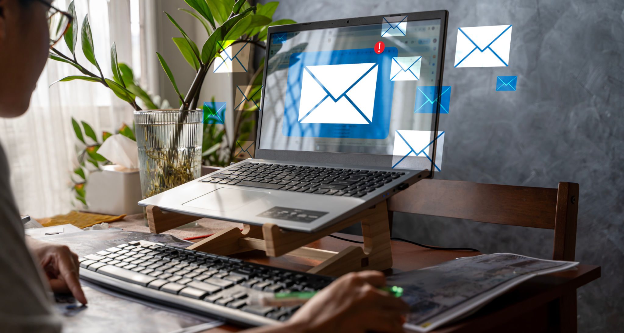 Person checking email notifications on laptop.